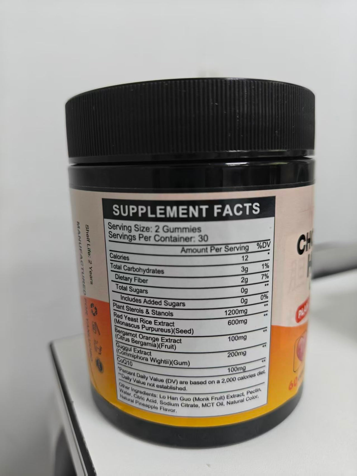 Gummies de Cholestérol YANLUOBO sur un fond coloré
