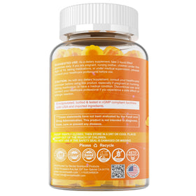 Gummies de Curcuma NEVISS près d'une bouteille d'eau
