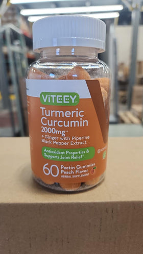 Gummies de curcuma Viteey avec fruits frais en arrière-plan