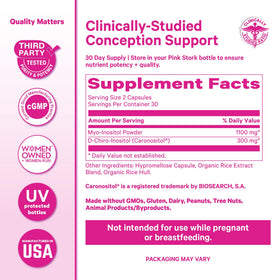 Gummies de fertilité Pink Stork à côté du flacon de capsules