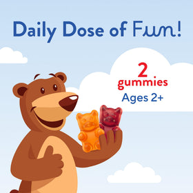 Gummies Lil Critters à côté d'un verre d'eau