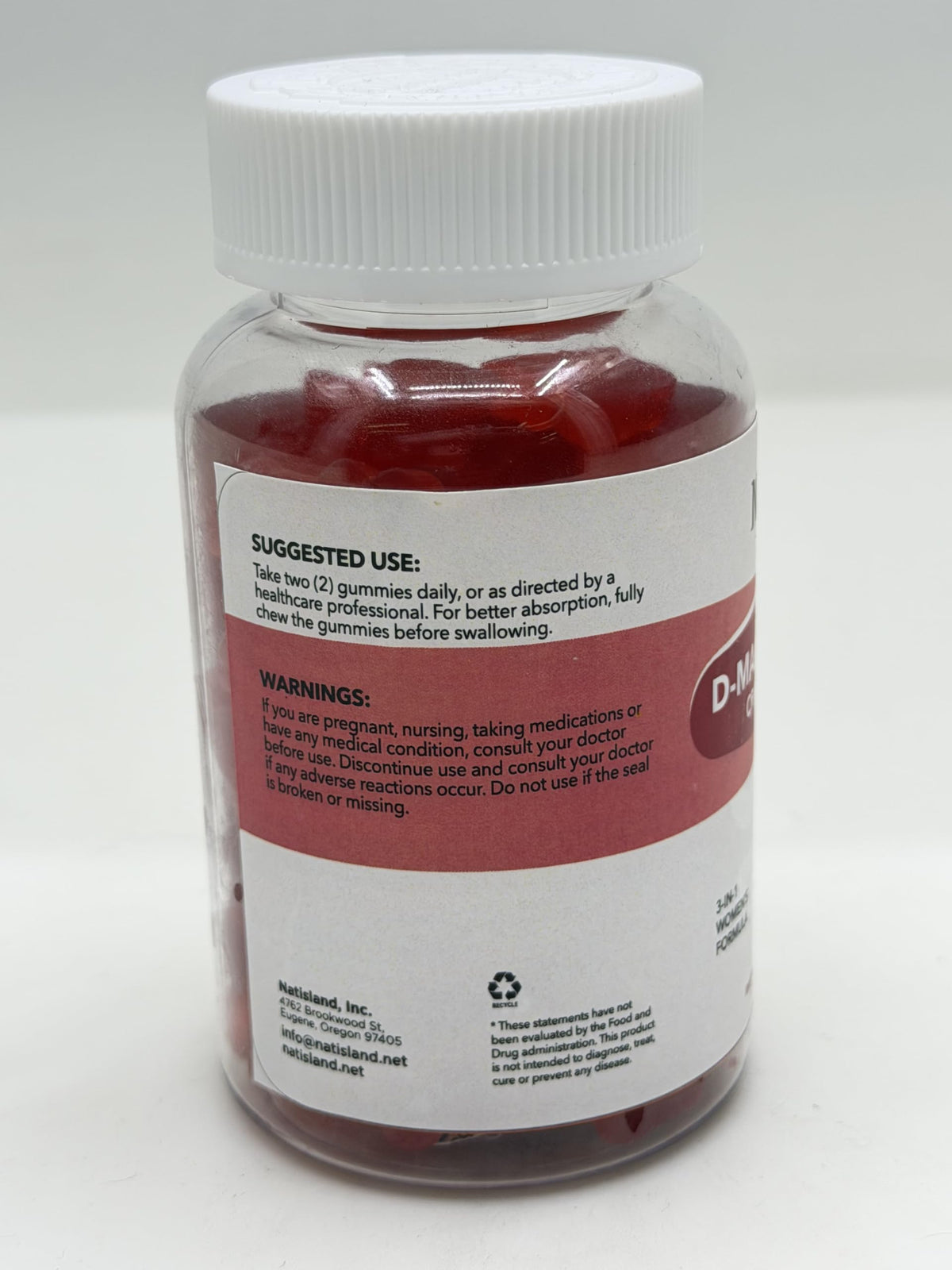 Gummies NATISLAND D Mannose sur une table en bois