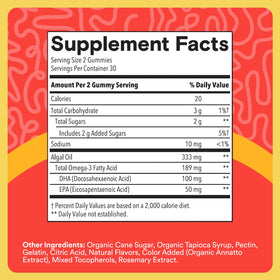 Gummies Omega-3 SmartyPants pour enfants à côté d'un fruit