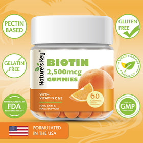 Gummy Biotine Nature's Key sur une table avec fruits frais