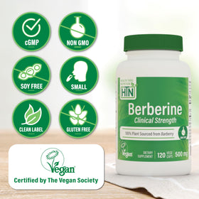 Health Thru Nutrition Berberine HCl 500mg capsule à côté d'une pièce de monnaie pour échelle
