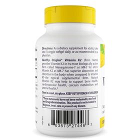 Healthy Origins Vitamine K2 gélule végétale à côté d'une cuillère