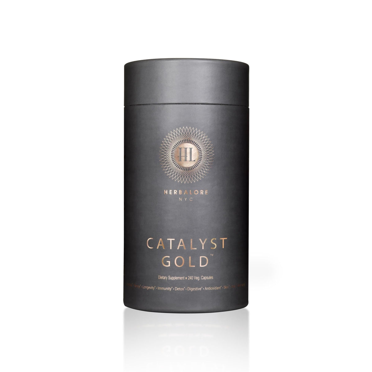 Herbalore Catalyst Gold capsules sur une table en bois