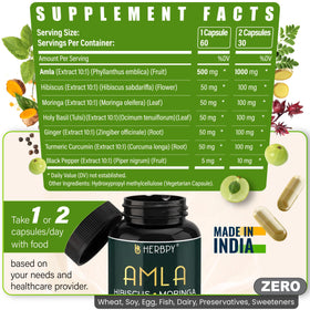 Herbpy Amla 7-en-1 capsules avec un verre d'eau