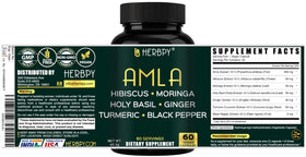 Herbpy Amla 7-en-1 capsules sur une table en bois