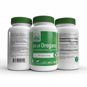Huile d'origan Health Thru Nutrition sur une table en bois