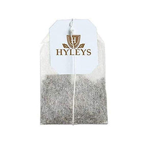 HYLEYS Thé Vert Bio Acai Berry & Myrtille sur une table avec des fruits