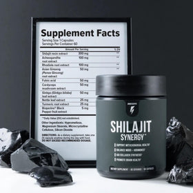 Inno Shilajit Synergy sur une table avec des accessoires de fitness