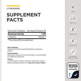Integrative Therapeutics L-Theanine capsules sur une surface en bois