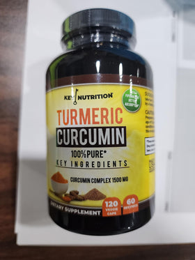 Key Nutrition Complexe Curcuma Curcumin capsules sur un fond blanc
