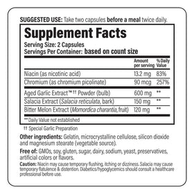 Kyolic Aged Garlic Extract 100 capsules sur une table en bois