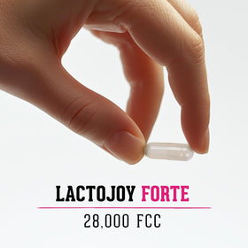 LactoJoy Forte capsules de lactase 28 000 FCC, sur une table de repas