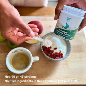 Layer Origin PureHMO poudre prébiotique 132g avec un verre d'eau