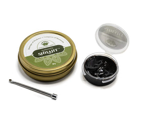 Lotus Blooming Herbs Shilajit résine vue latérale dans un verre