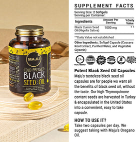 Maju Superfoods capsules d'huile de graines noires dans une main