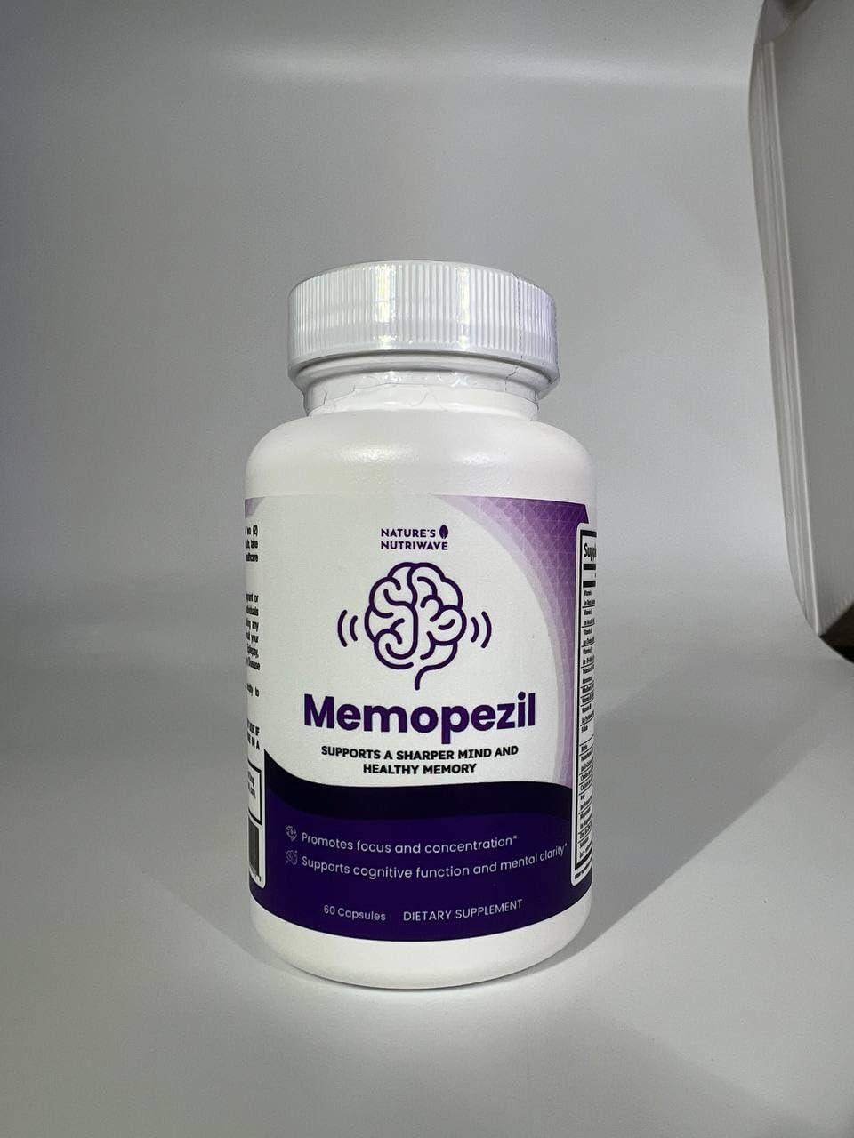 Memopezil, flacon ouvert avec capsules visibles