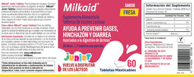 Milkaid Junior comprimés à mâcher saveur fraise, prise en main d'un comprimé