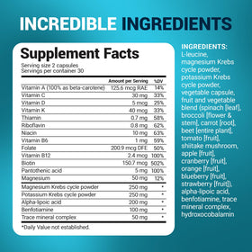 Multivitamines Dr. Berg sur une table avec des fruits