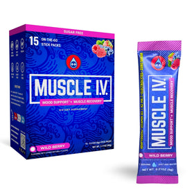 Muscle I.V. Magnésium Glycinate sachets à côté d'un verre d'eau