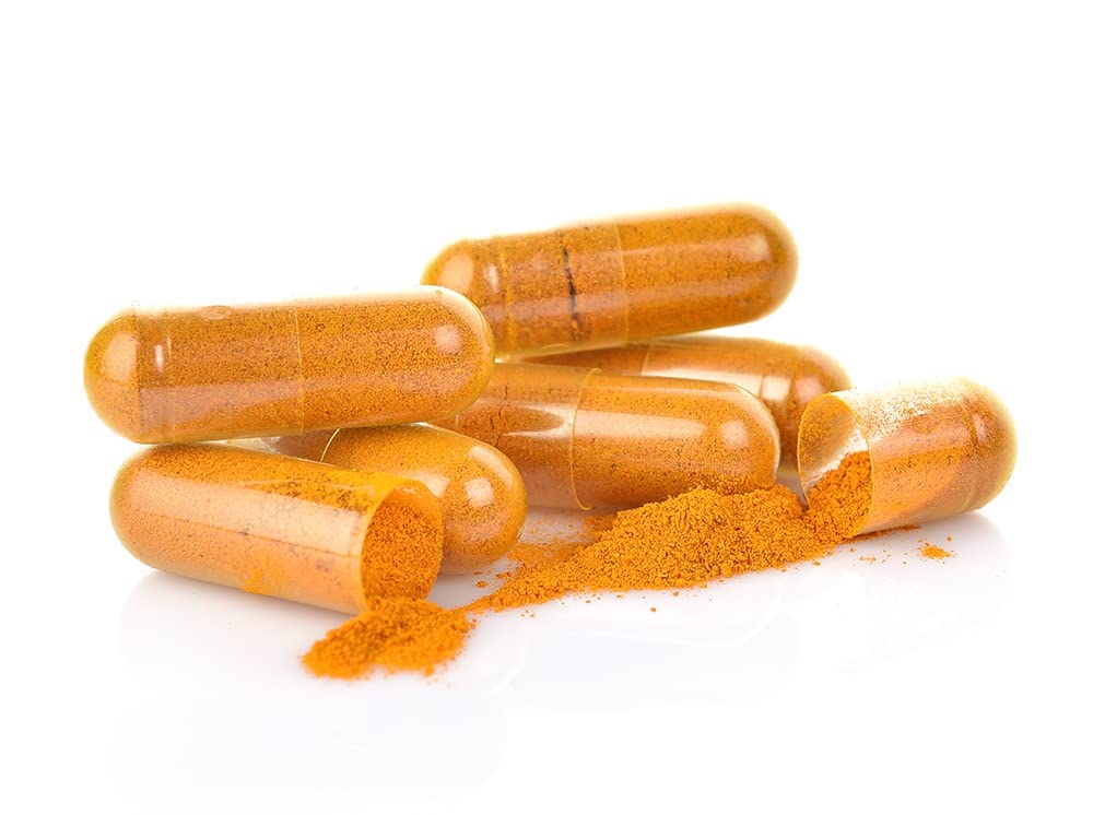 Nanocur Curcuma capsules et verre d'eau
