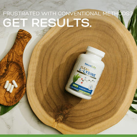 Natural Labs L-Lysine 600mg capsules in a hand