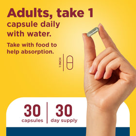Nature Made Capsules Confort Articulaire 3-en-1 sur une table avec verre d'eau