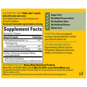 Nature Made Cranberry 500mg capsules with a glass of water