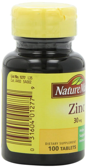 Nature Made Zinc 30mg comprimés sur une table avec d'autres vitamines