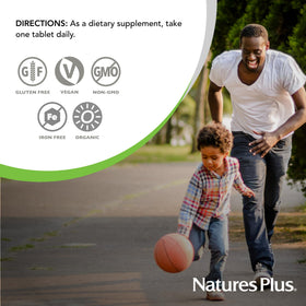 Nature's Plus Multivitamines Masculines Source of Life Garden comprimés avec fruits et légumes en arrière-plan