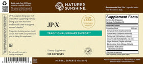 Nature's Sunshine JP-X capsules sur une table en bois