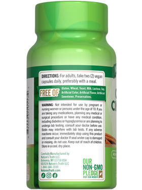 Nature's Truth Ceylon Cinnamon Capsules with a measuring spoon