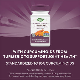 Nature's Way Curcuma Max Potence, gélules à côté d'une cuillère de curcuma