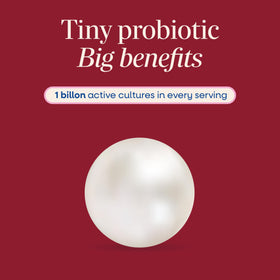 Nature's Way Pearls Complete Probiotic gélules molles à côté d'un verre d'eau