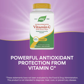 Nature's Way Vitamine C avec Églantier capsule à côté d'un verre d'eau