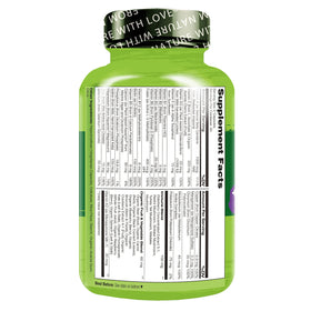 NATURELO Multivitamines Complètes capsules à côté d'un verre d'eau