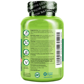 NATURELO Multivitamines pour Adolescents 120 Capsules à côté d'un verre d'eau