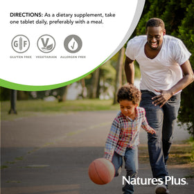 NaturesPlus Mega B-100 Complex, comprimés avec une main tenant le flacon