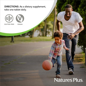NaturesPlus Multivitamines à Mâcher Ananas - comprimés dans une main