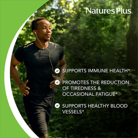 NaturesPlus Orange Juice Jr. comprimés à mâcher avec des oranges en arrière-plan