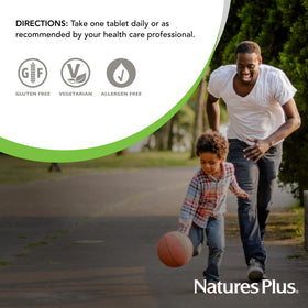 NaturesPlus Riz Rouge comprimés 600 mg et un verre d'eau
