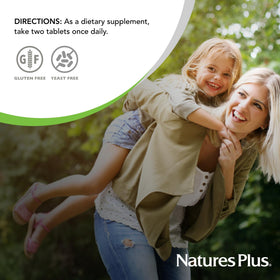 NaturesPlus Ultra Hair Plus comprimés dans une main