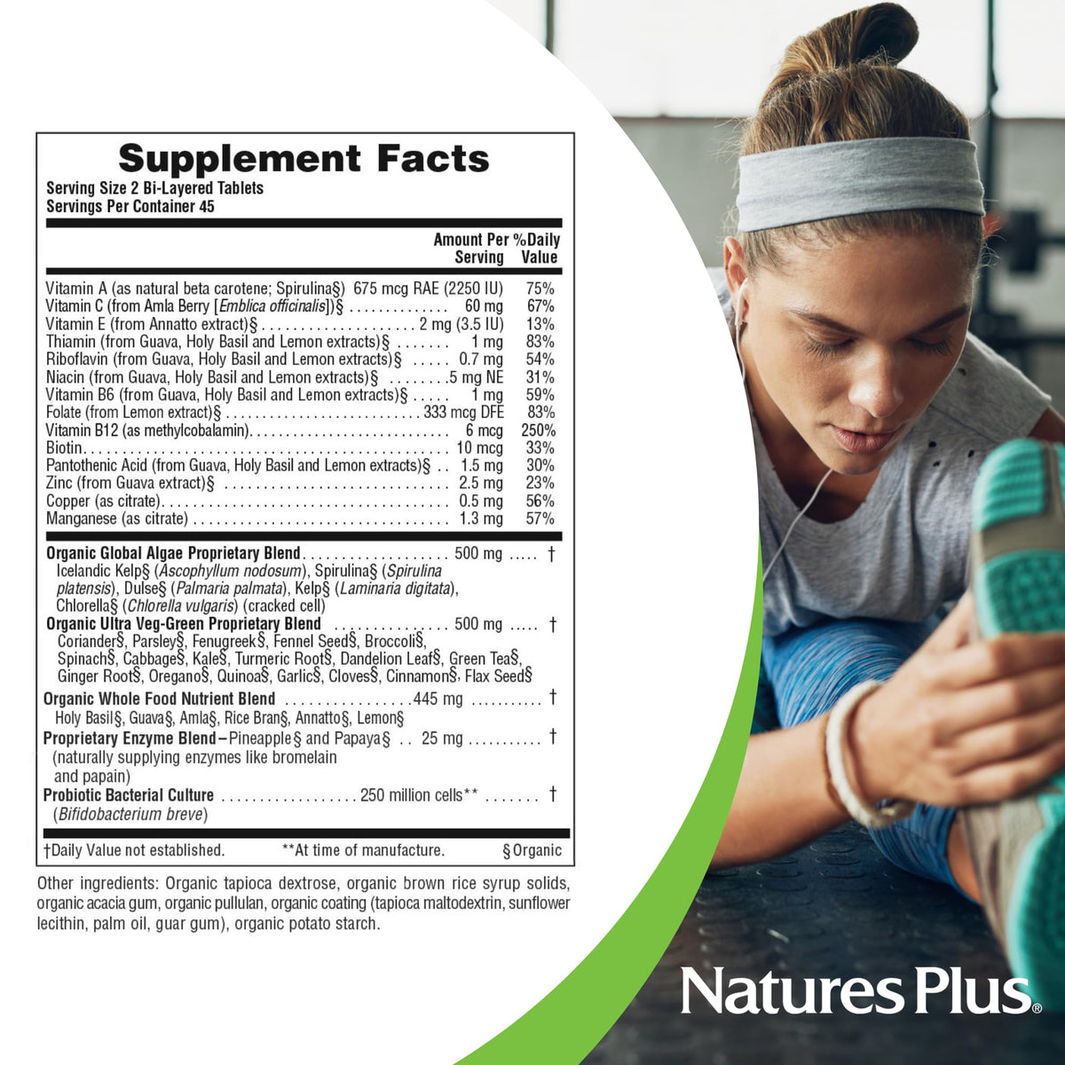 NaturesPlus Ultra Juice Green comprimés avec légumes en arrière-plan