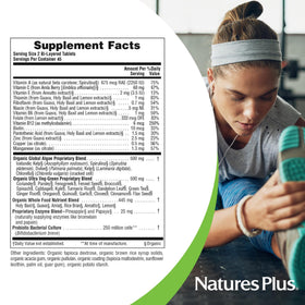 NaturesPlus Ultra Juice Green comprimés avec légumes en arrière-plan