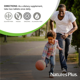 NaturesPlus Ultra Juice Green comprimés bi-couches avec bouteille ouverte