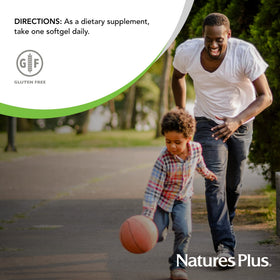 NaturesPlus Vitamine E 400 IU Softgels capsules sur une table