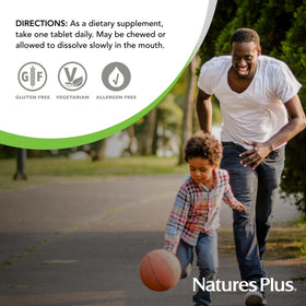 NaturesPlus Vitamine E, comprimés à mâcher sur une surface en bois